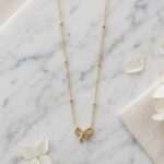 Golden Bow Satellite Necklace