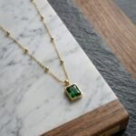 Golden Emerald-Cut Green Crystal Satellite Necklace